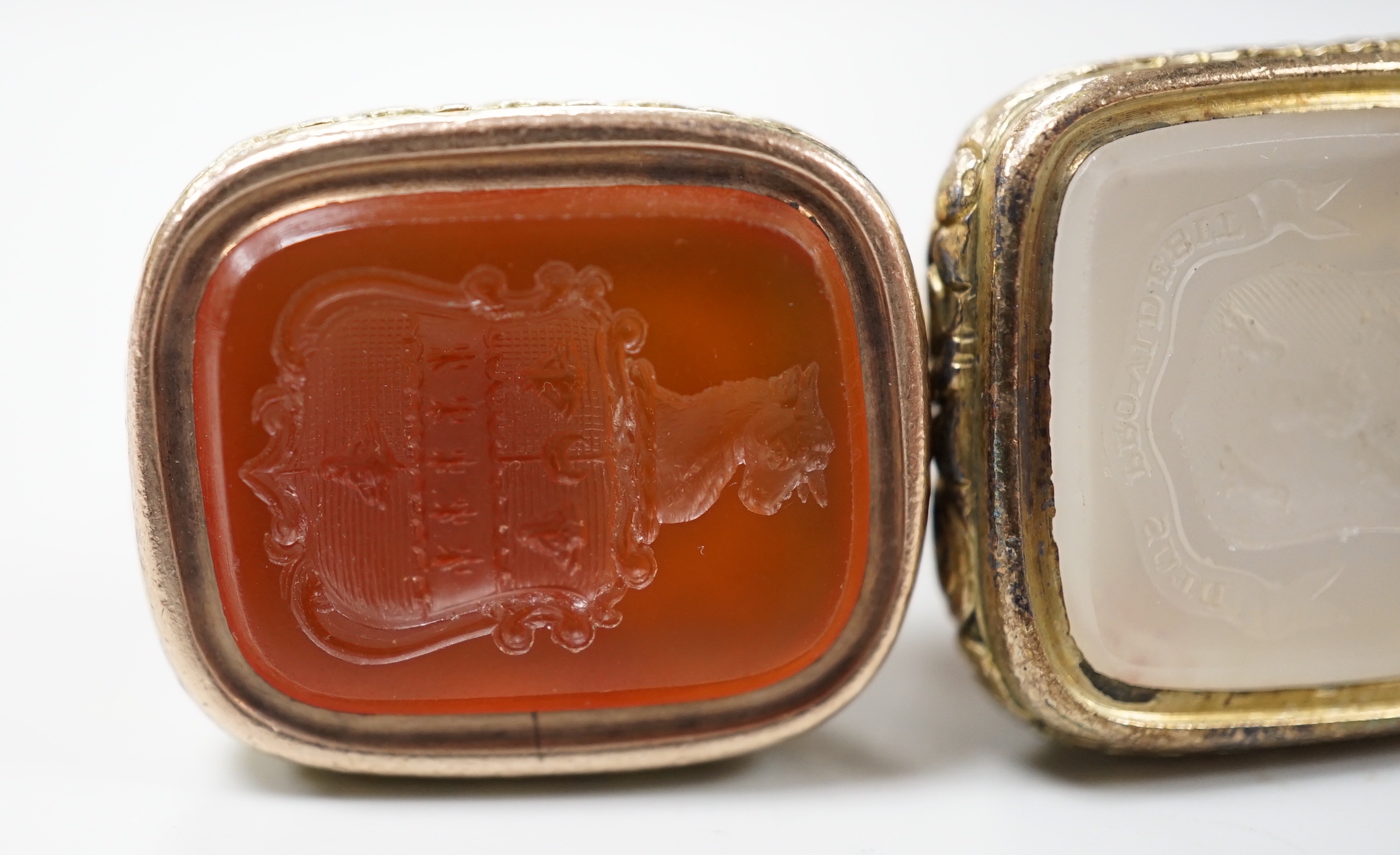 Three assorted Georgian gold plated and chalcedony set fob seals, two with carved matrix, approx. 35mm.